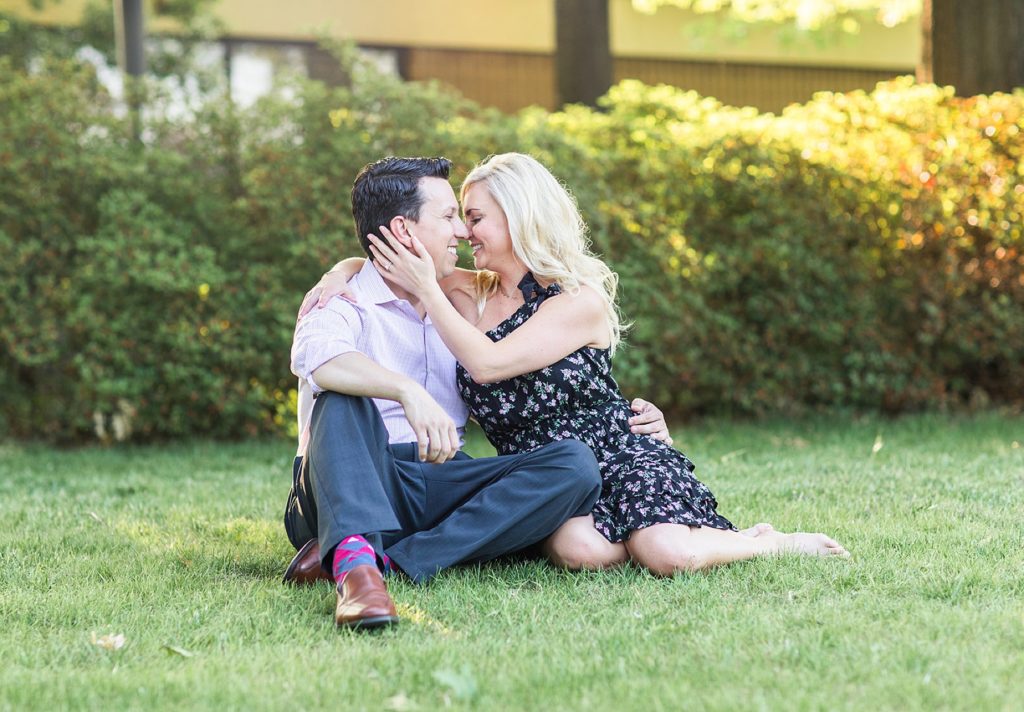 Couple nuzzling in grass