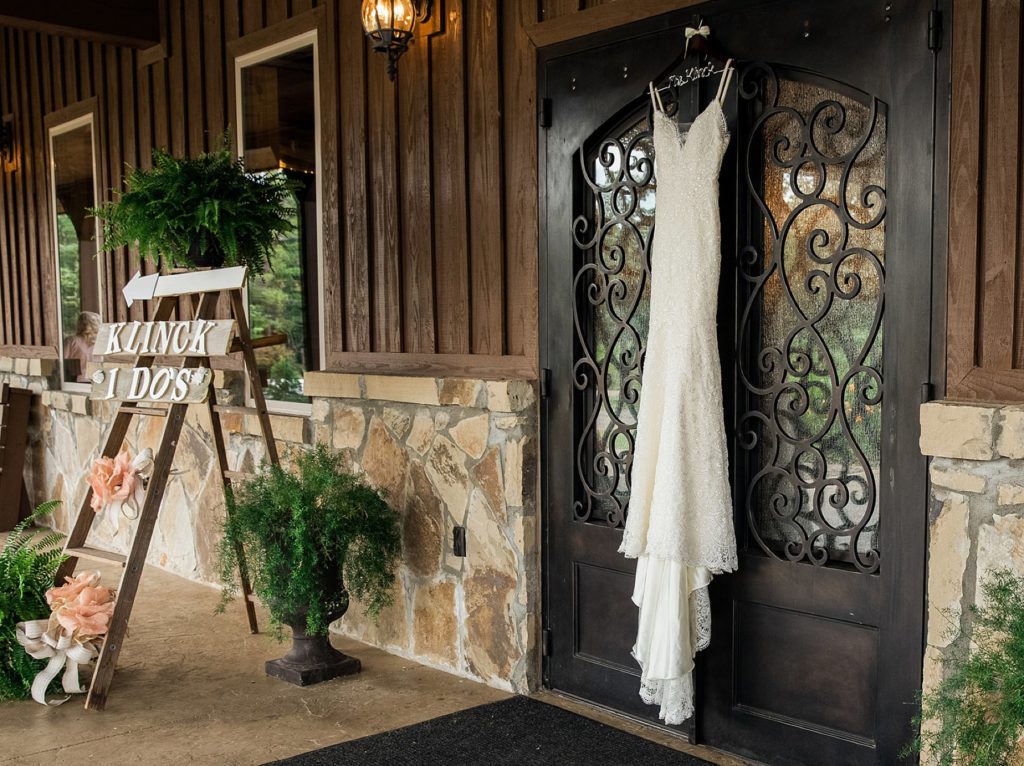 Wedding gown hanging on doors at The Springs wedding