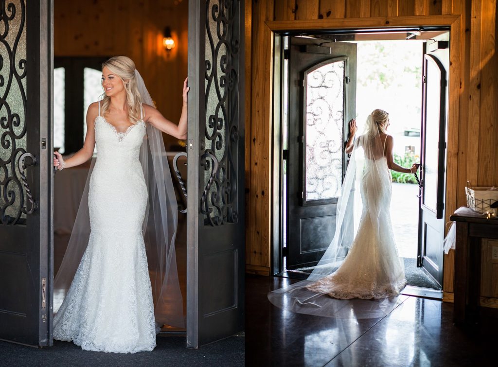 Bride standing in French doors in wedding gown and long wedding veil at The Springs Event Center