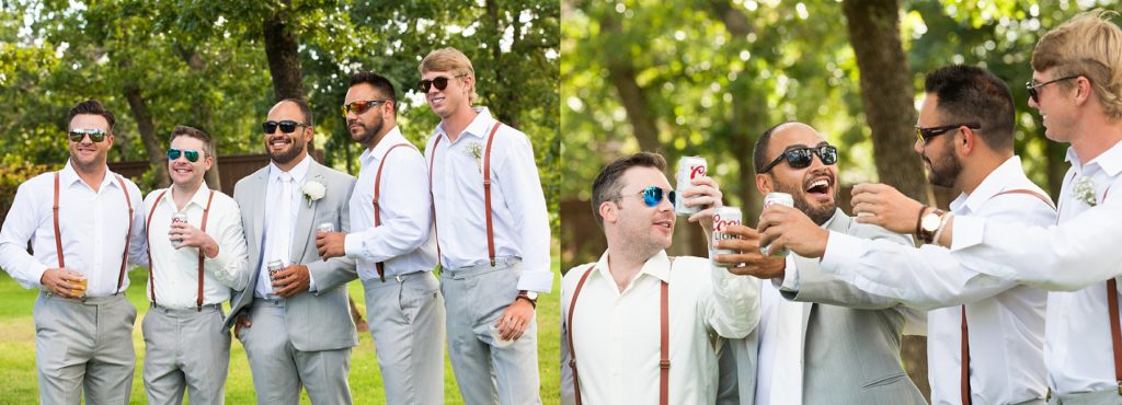 Groom and groomsmen in grey and red suspenders toasting outside at The Springs Event Center