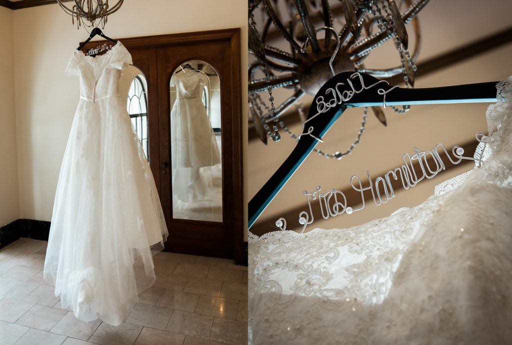 Wedding dress hanging from chandelier on specialized wedding hanger