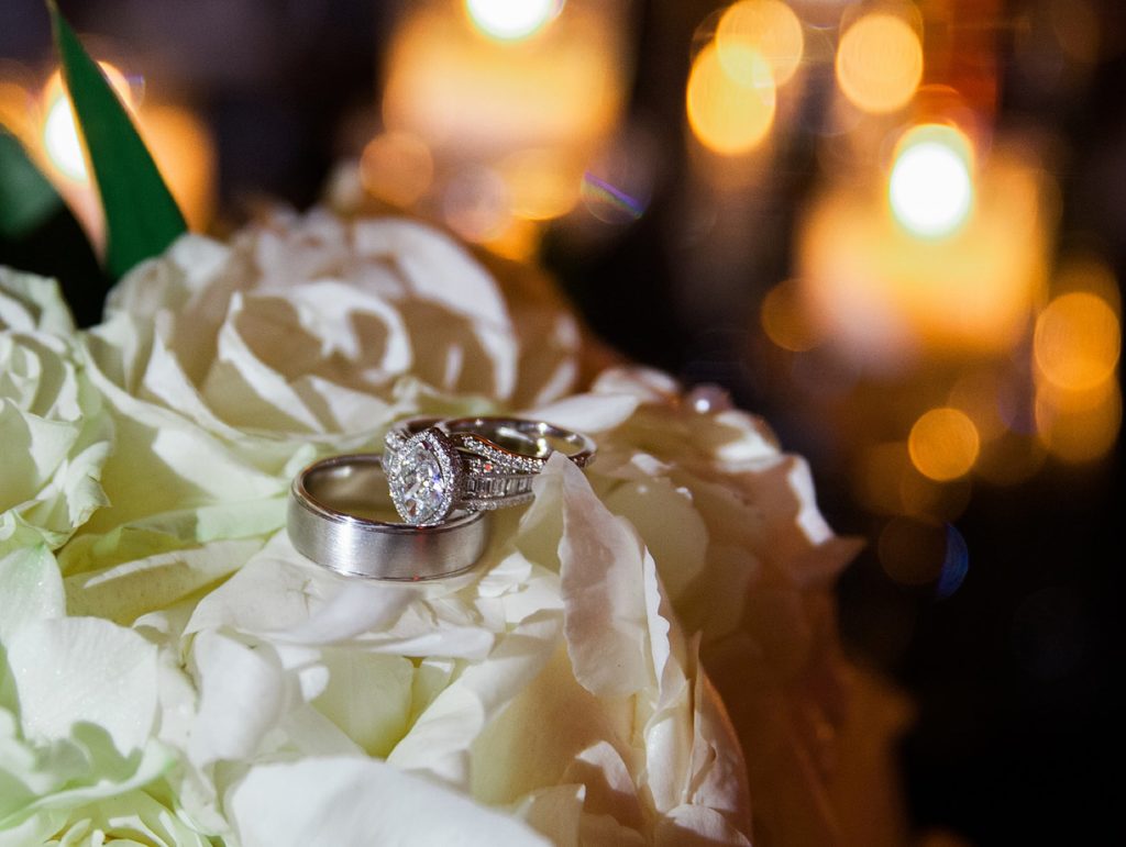 Wedding rings on white roses